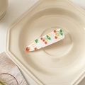 Detail of transparent strawberry and flower acrylic hair clip on a ceramic tray - White with Small Cherry