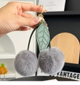 Gray plush cherry keychain with green leather leaves and golden ring fastener - Gray