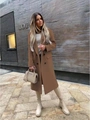 Full-body street view of a camel double-breasted wool coat with notch lapel and flap pockets - S / Tops / Khaki