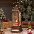 Vintage-Weihnachtslaterne in Bronze mit Weihnachtsmann und wirbelndem Schneeeffekt - Laterne Fest Weihnachtsmann an Straßenlaterne