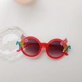 Kids round red sunglasses featuring sparkling rainbow unicorn frames and dark lenses - Transparent Red