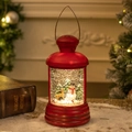 Lanterna di Natale rossa retrò con pupazzo di neve e luci LED calde in scena - Lanterna ad Acqua Ovale Rossa - Pupazzo di Neve e Renna