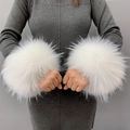 A pair of large white faux fur cuffs worn over a grey long sleeve dress on a grey backdrop - White Jacquard