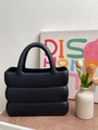 Black EVA handbag with unique 3D wave texture and minimalist integrated handle design - Black
