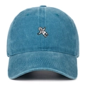 Close-up of astronaut embroidery and stitch details on washed denim baseball cap - Lake Blue