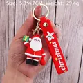 PVC Santa Claus 3D keychain with red Christmas wrist strap held in hand for scale - Santa Claus-15