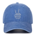 Front detail of washed blue denim baseball cap with Good Vibes skull hand embroidery - One Size / Light Blue