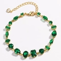 Detailed macro view of green crystal stones in gold settings with lobster clasp closure - Mixed Geometric Style (Model 3) / Gold