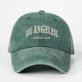 Detailed close-up of Los Angeles vintage embroidery on green washed cotton baseball cap - Dark Green