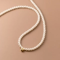 Elegant pearl necklace with a single gold-plated bead accent on a warm beige background - 7【h381】pearl Necklace Gold