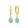 Macro detail of gold-plated silver earrings with oval sky blue stone and zircon halo - Halo Oval Blue Stone Gold (13)