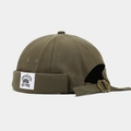 Detailed close-up of army green brimless beanie with Brooklyn label and metal buckle - Adjustable / NEW YORK Patch Olive Green