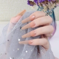 Detailed view of long coffin press-on nails in translucent nude orange pink with high gloss - Orange Pink (CBLL-37)