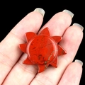 Hand-carved red jasper sun stone pendant with natural black veins and polished finish - Red Jasper