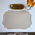 Beige faux leather oval placemat with vintage embossed patterns on white table - Embossed Irregular Beige