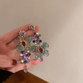 Detailed view of colorful crystal flower earrings with vintage gold metal setting - Colorful Crystal Flower Cluster (1 Silver Earring Post. Purple)