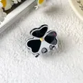 Small acetate clover hair claw clip with black and white pattern and rhinestone accent - White