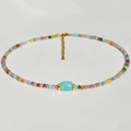 Collana y2k fatta a mano con perle colorate sfaccettate e pietra a botte blu al centro - Amazzonite Blu