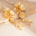 Detailed close-up of golden metal mesh flower earrings with rhinestones on a stone base - Flower Petal Tassel Long Style / Gold