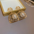 Vintage golden hollow cage earrings with large white pearls in a retro elegant style - Gold Birdcage Shape