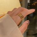 Detailed view of an 18k gold-plated stainless steel chain link ring on a finger - KTG033J-Metal Chain Weave Style