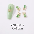 Detalle de los dijes de mariposa ojo de gato 6x10mm para uñas con base de aleación dorada - Estilo de Marco Dorado Con Combinación de Piedras Preciosas y Lazo (9817)