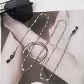Detail of silver stainless steel glasses chain with non-slip loops on fashion magazine - Chain Length 70cm / Silver-Black Loop