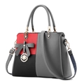Damen-Handtasche aus PU-Leder mit grau-rot-schwarzem Color-Blocking und Schleifen-Detail - Grau Color-Block