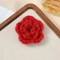 Detailed view of a handmade 7cm red crochet flower with three-layered petal texture - 7cm / Mohair Dark Red