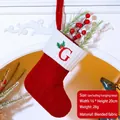 Red knit Christmas stocking with embroidered G letter and white cuff decoration - Letter G / Red