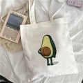 White canvas tote bag featuring a cute avocado cartoon print and minimalist art style - Cartoon Avocado