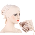 Detail of adjustable beige satin-lined headwear with drawstring and smooth inner fabric - Beige