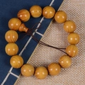 Traditionelles Armband aus goldenem Sandelholz mit Wellenmaserung und Seidenband - 15mm*15 Perlen/Feines Loch Stil