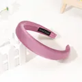 Detail of light purple satin headband showing smooth silk luster and handmade label - Dust Rose