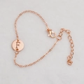 Rose gold chain bracelet with a round hollow pendant engraved with the letter F - Rose Gold F