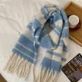 Soft knit scarf with blue and white stripes and tassel ends on white bedding - Sky Blue