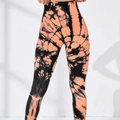 Oranje en zwarte tie-dye yoga broek met hoge taille en push-up effect voor fitness - S / Koraal Oranje