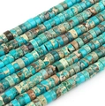 Macro detail of flat round blue imperial jasper spacer beads for DIY jewelry making - Lake Blue