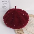 Kids burgundy wool beret with pink pearl accents on a stylish decorative setup - One Size / Burgundy