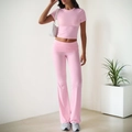 Women's pink two-piece casual set with short sleeve crop top and high waist flared pants - S / Pink