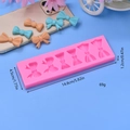 Pink silicone bow mold with 6 cavities for DIY fondant cake baking and chocolate crafting - Long Strip Bow Style (2)