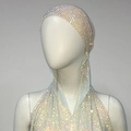 Detailed macro view of sparkling AB rhinestones on the elastic mesh turban party headpiece - White AB Rhinestones
