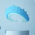 Blue crown-shaped baby shampoo shield with adjustable strap and protective ear flaps - Small Crown Blue