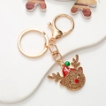 Close-up of a Christmas reindeer keychain with brown rhinestones and colorful enamel detail - Reindeer (Gold) (D2850)