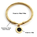 Gold plated stainless steel bangle featuring a Roman numeral pendant on a white background - Black Dial Roman Numeral Pendant / Gold