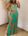 Detail view of the green floral maxi dress featuring a high side slit and abstract print - S / Green