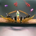 Detailed wire-wrapped gold wings headband with iridescent prism and black crystal pillars - Black Crystal + Gold Wings