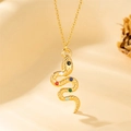 Goldene Edelstahl-Schlangenkette mit bunten Edelsteinen auf warmem Stoffhintergrund - 40+5cm / Goldschlange Mit Bunten Edelsteinen