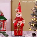 Christmas snowman figurine on red gift box with gold ribbon, 45cm festive table decor - Snowman with Gift
