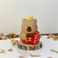 Handcrafted wooden capybara figurine with yellow crown and red brick texture on base - Tang Sanzang (Monk)